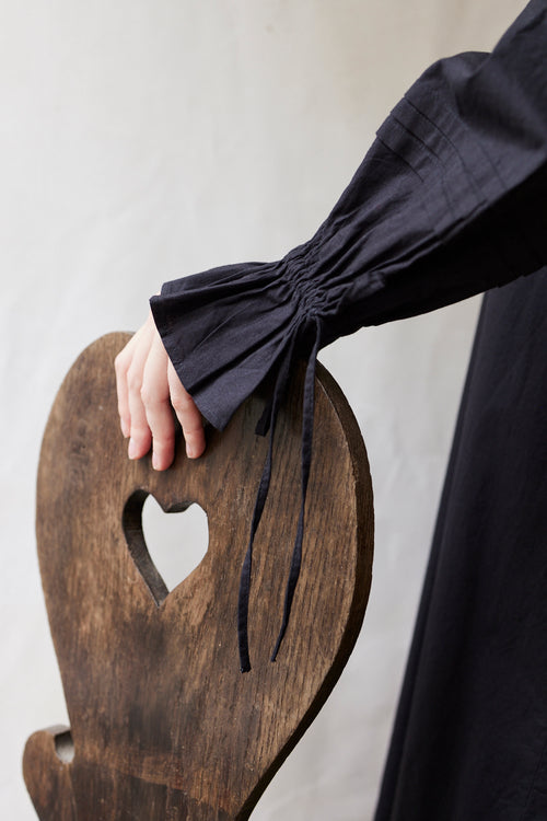 "Cosima" black shift dress with long sleeves