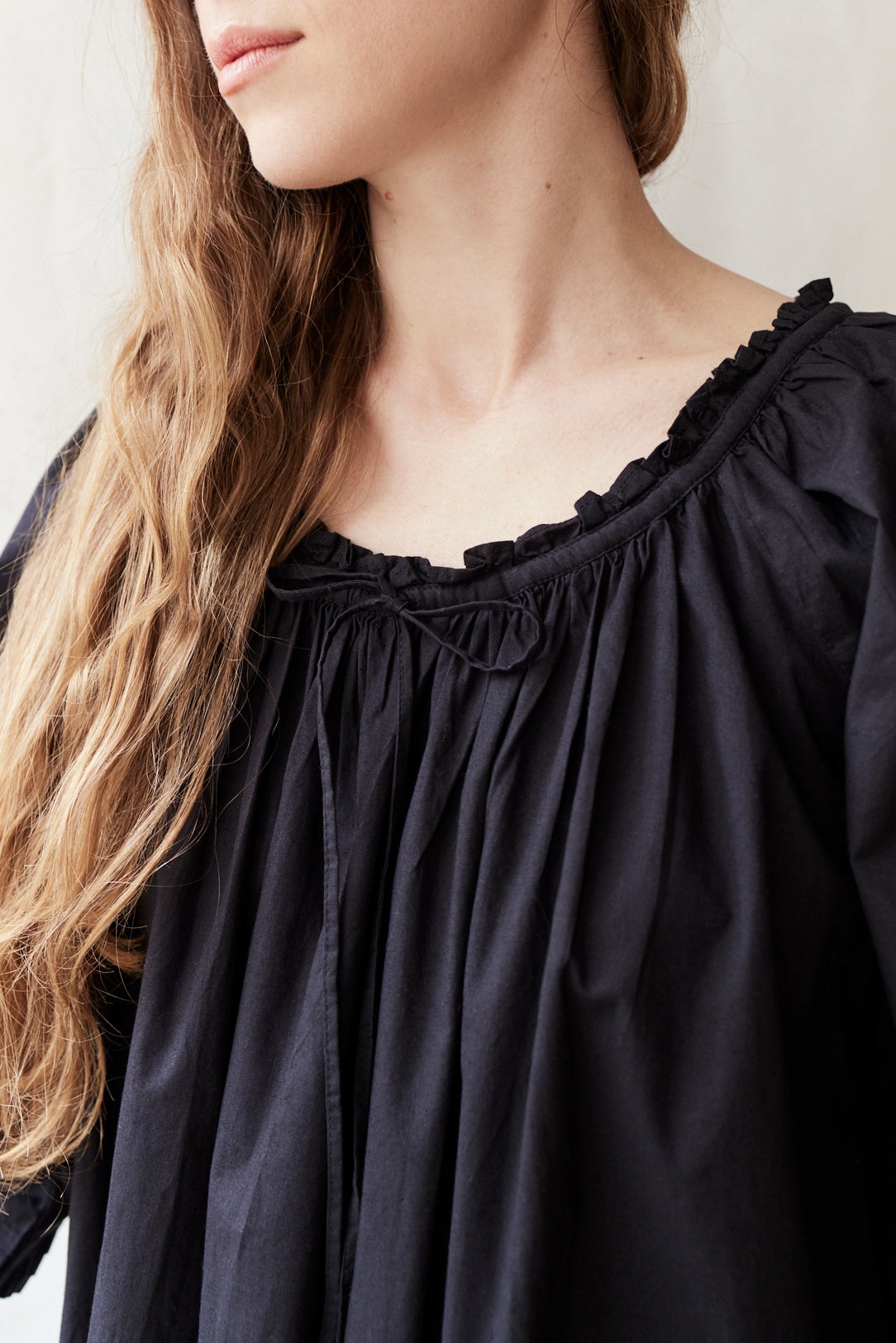"Cosima" black shift dress with long sleeves