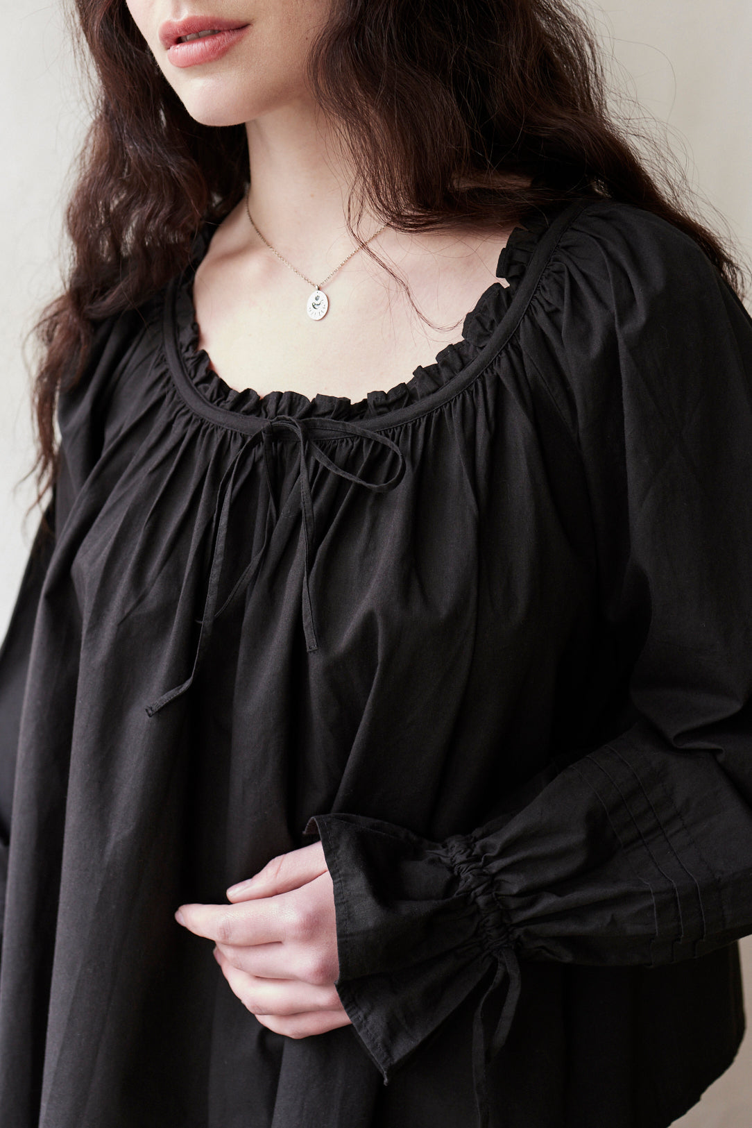 "Cosima" black top with long sleeves