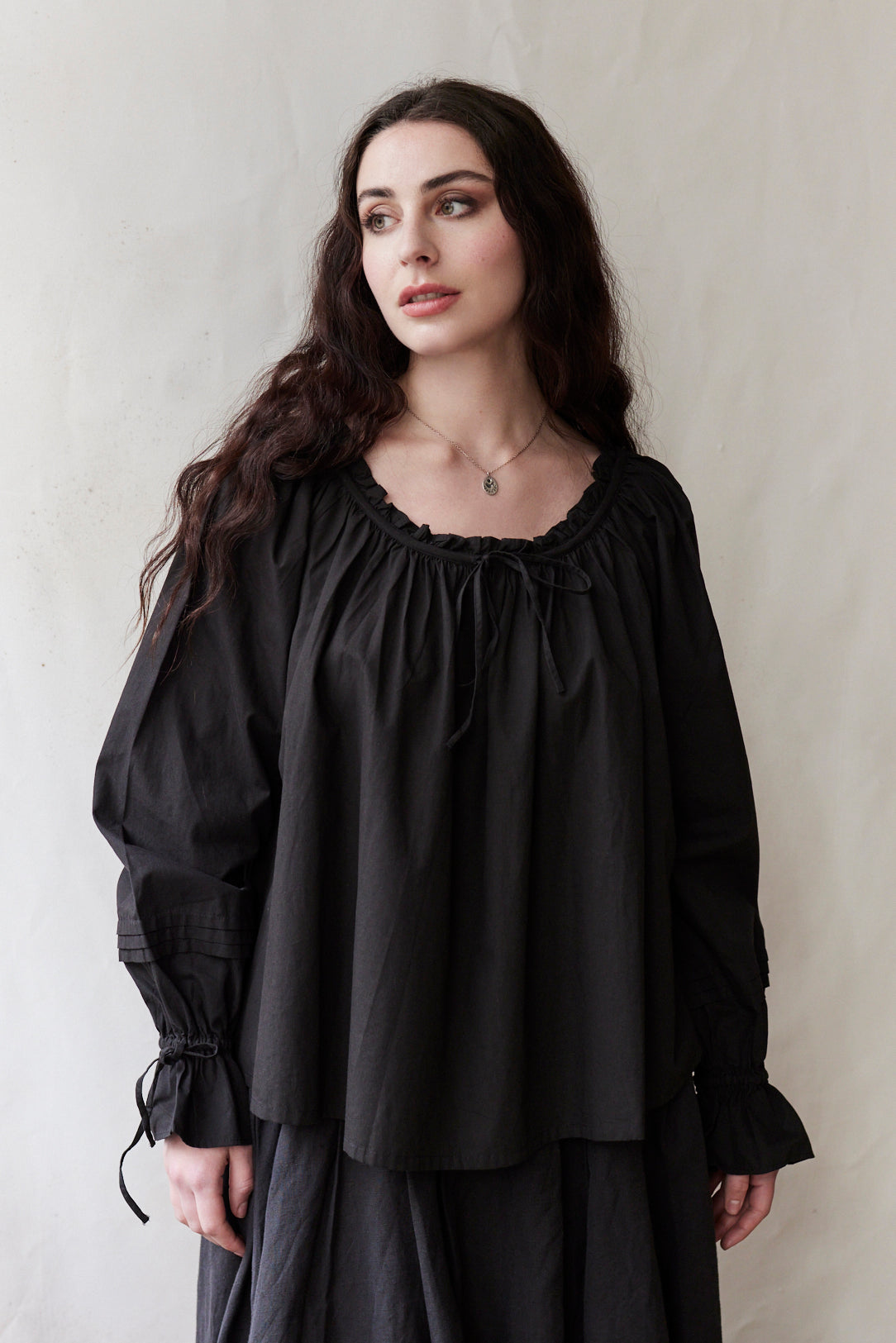 "Cosima" black top with long sleeves