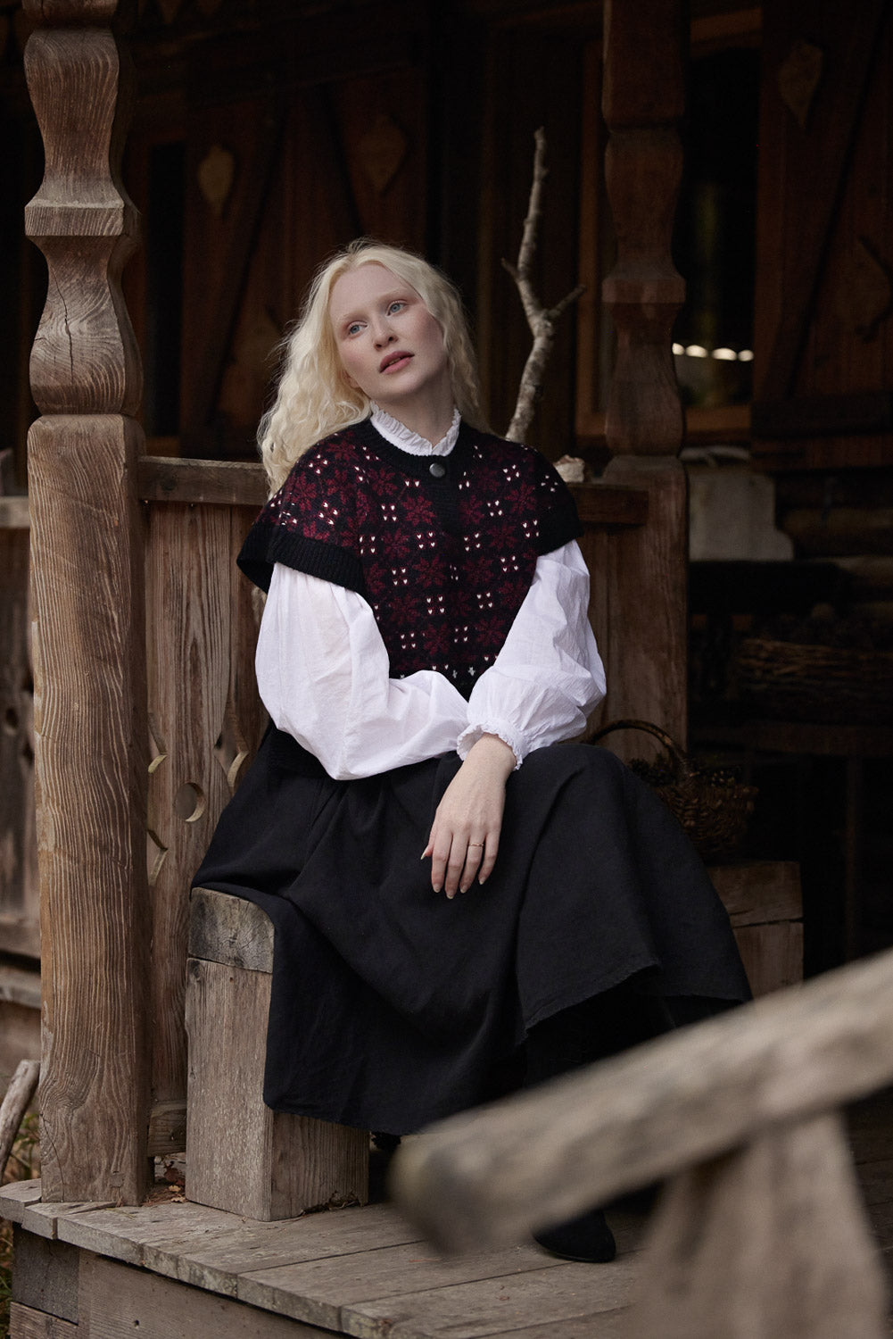 “Modra” cropped knit layer in pure Wool black and burgundy