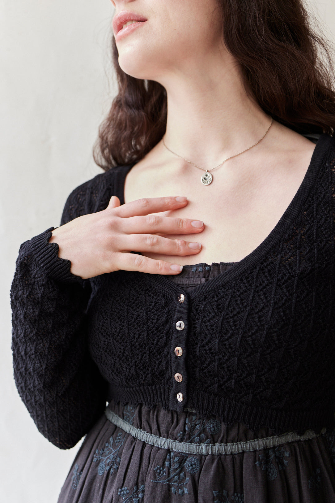 "Mona" cropped lace cardigan in black cotton, long sleeves