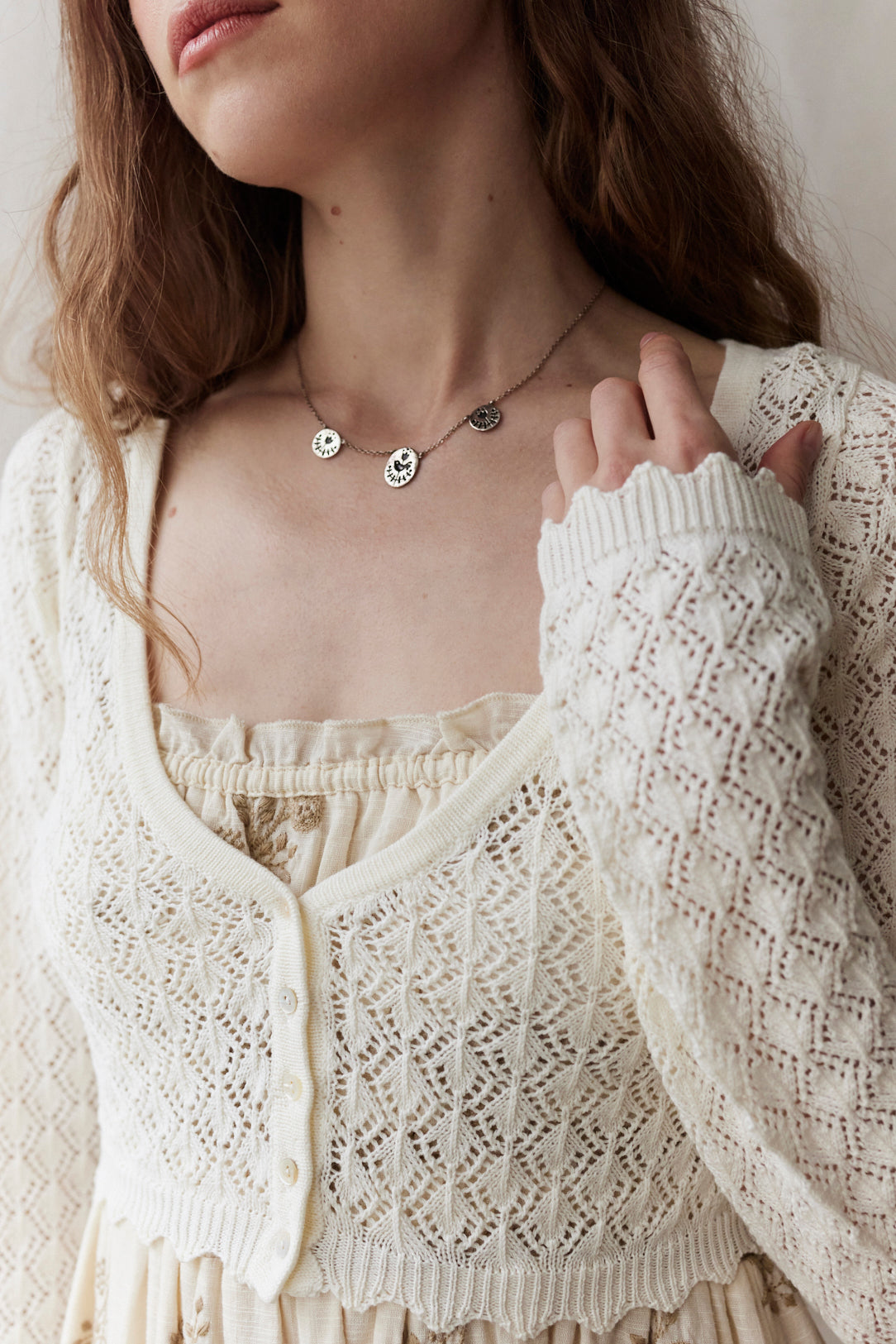 "Mona" cropped lace cardigan in cream cotton, long sleeves