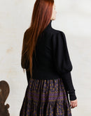Pull col roulé 'Ariana' en coton et cachemire avec manches gigot noir