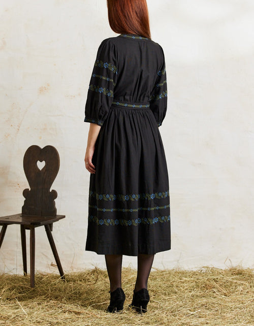Tabea embroidered Black crossover dress with blue flowers
